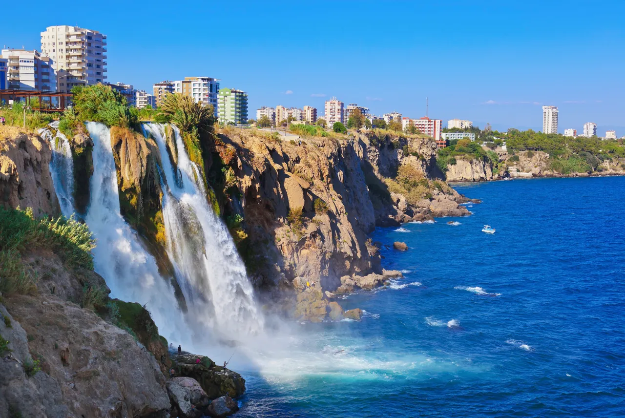 Düden Waterfall flowing into the Mediterranean along Antalya's coastline.
